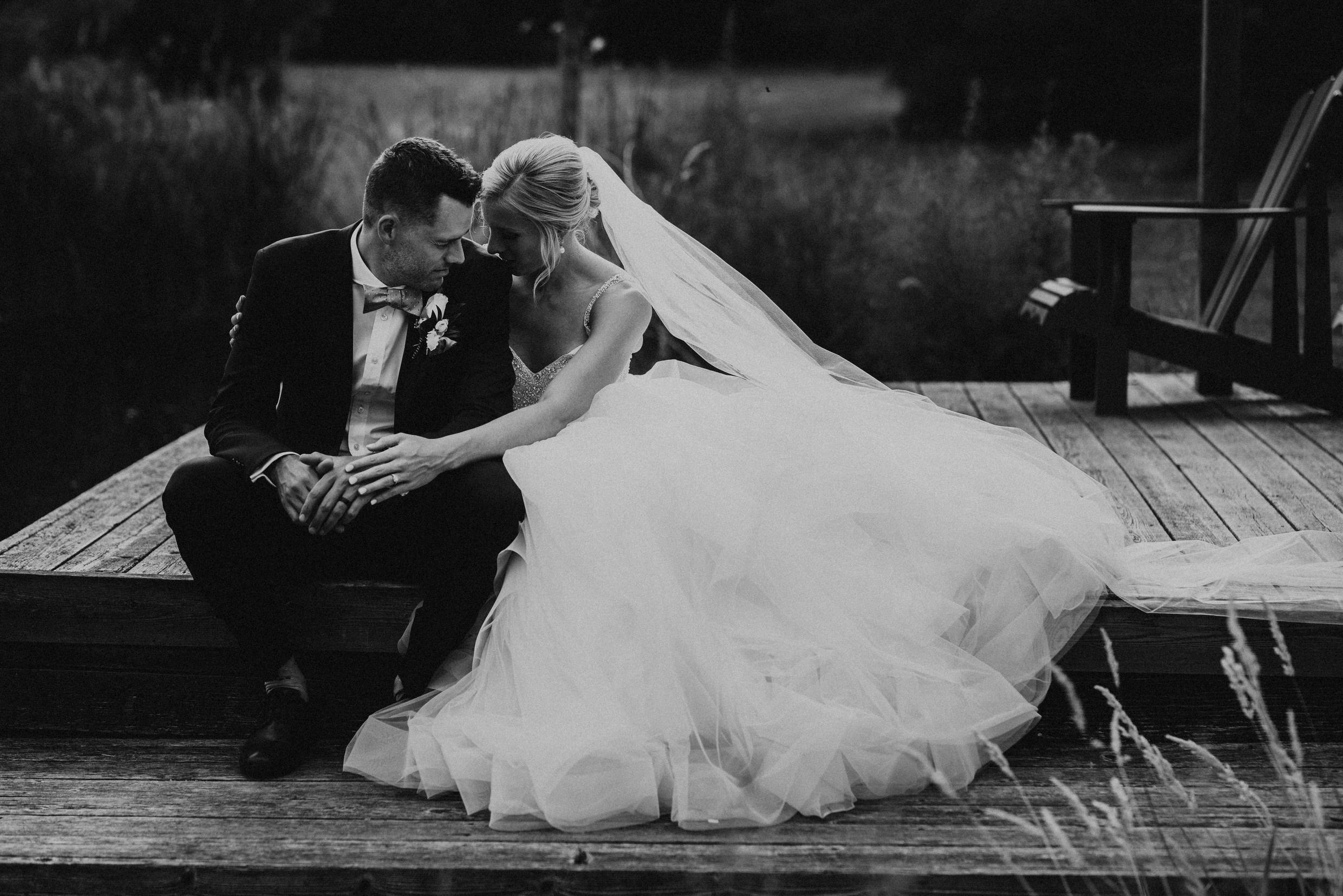 Belcroft Estates Wedding - bride and groom embrace on the dock