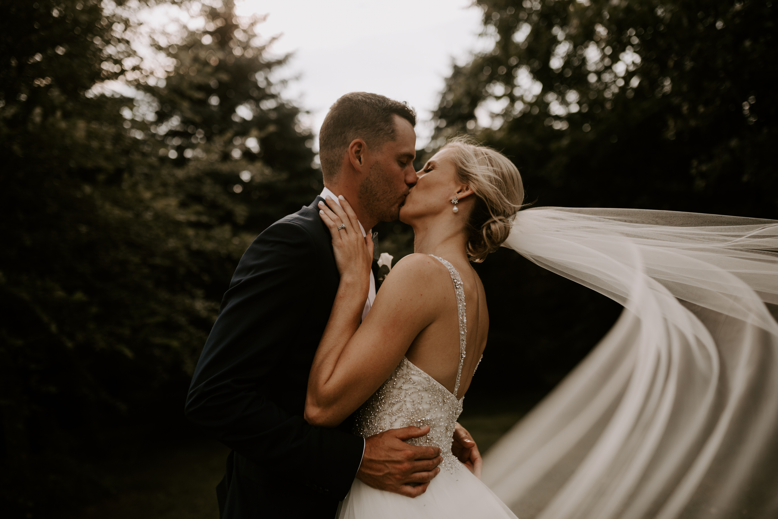 Belcroft Estates Wedding - bride and groom kissing veil