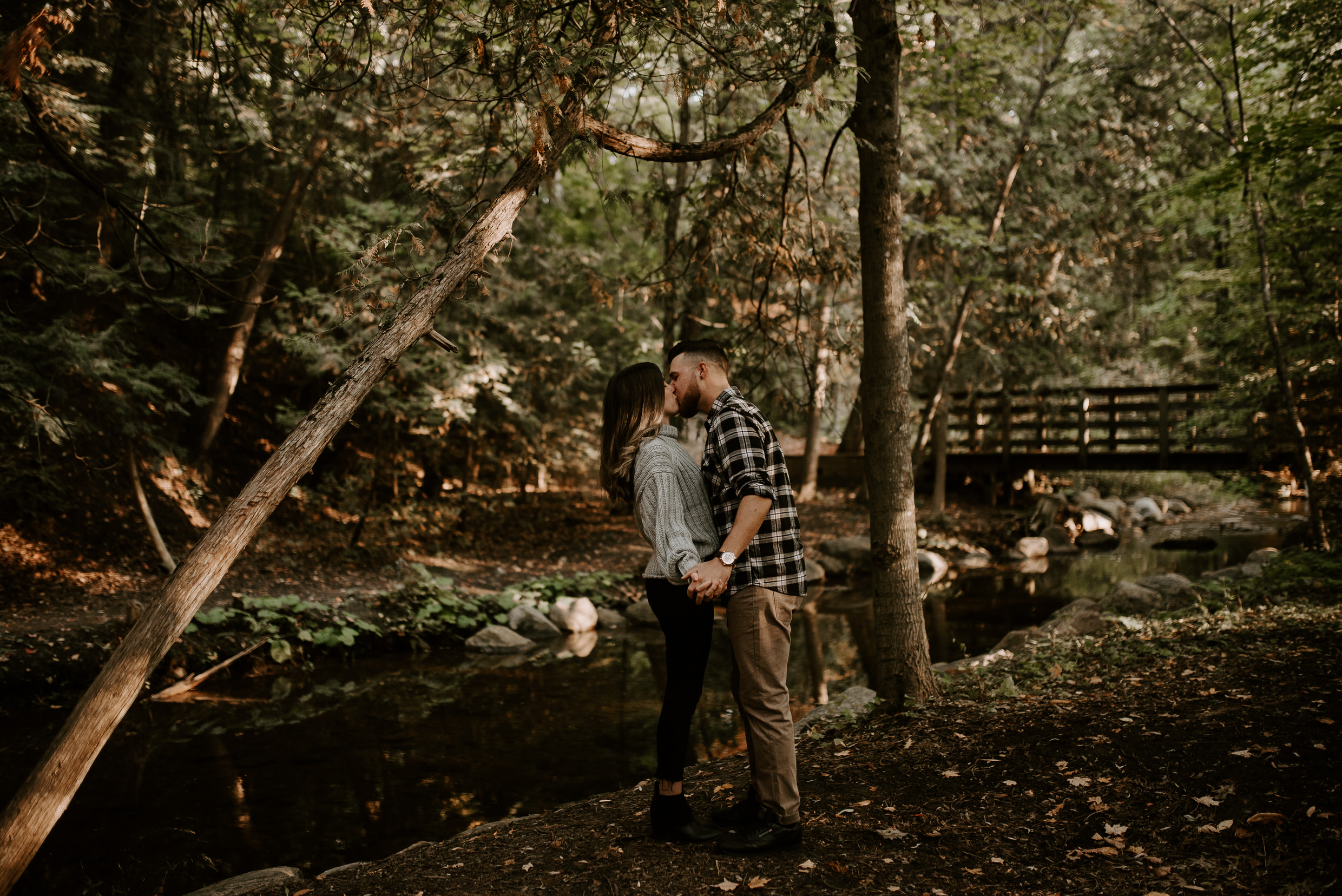 Muskoka Engagement Session - kissing by the river