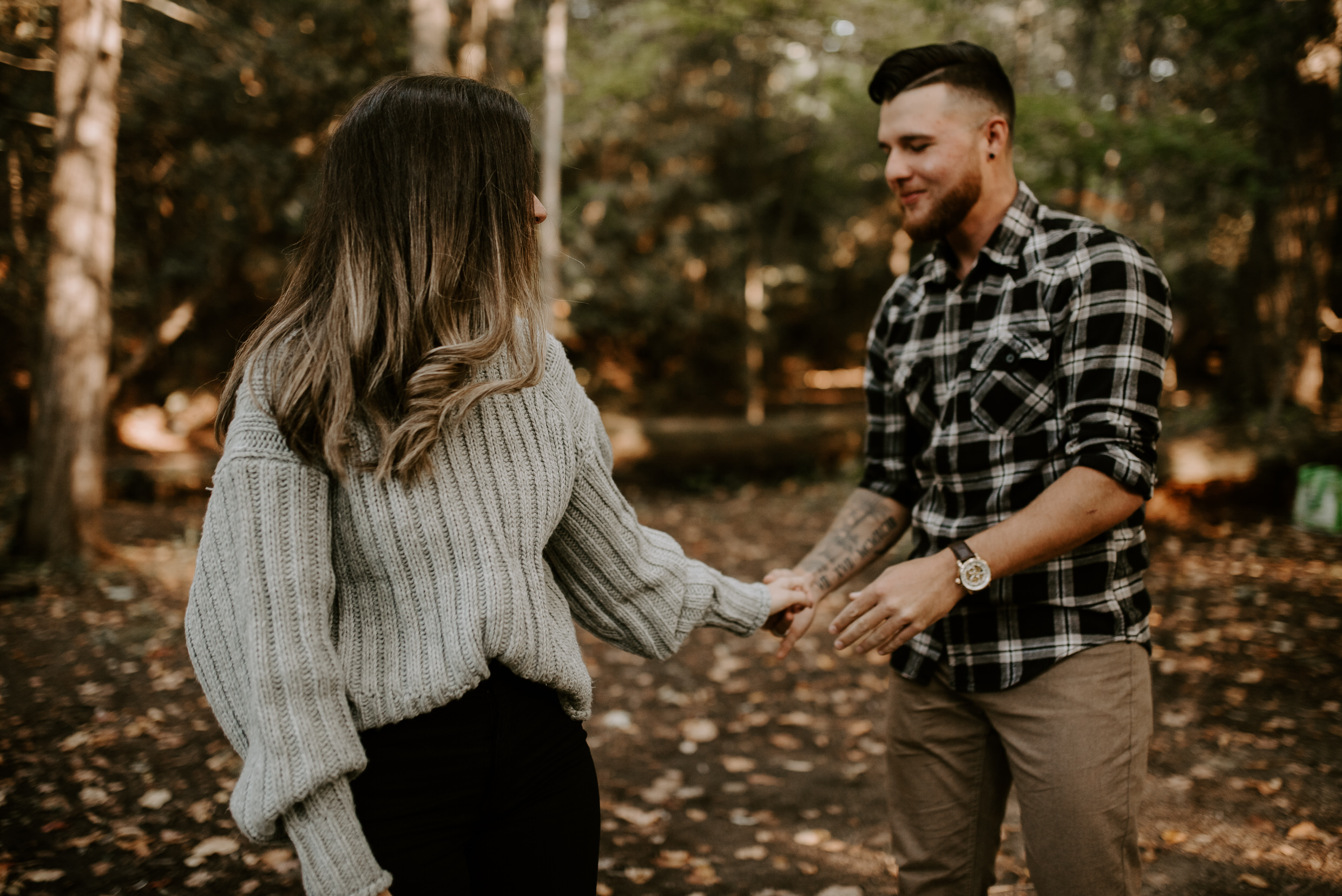 Muskoka Engagement Session - holding hands in the woods